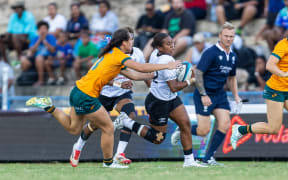 Fijiana centre Josivini Naihamu tries to run away from the Wallaroos defence on Saturday.