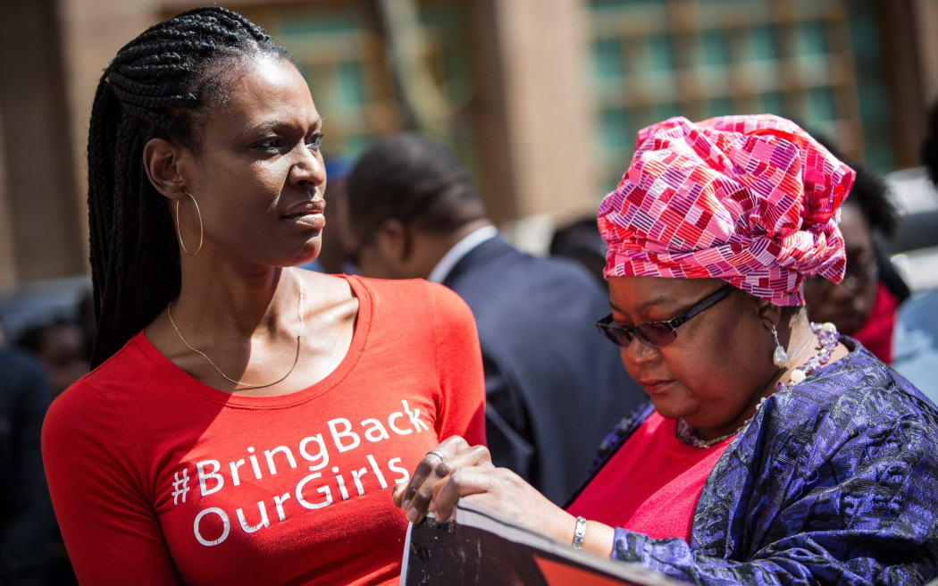 Women attend a rally bringing attention to the one year anniversary of the kidnapping of hundreds of Nigerian school girls on April 13, 2015 in New York City. The terrorist organization Boko Haram kidnapped more than 220 girls last year, many of whom remain missing.