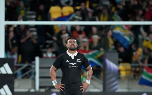 All Black Ardie Savea stands dejected.