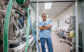 Dr Alberto Ramirez - lead anaesthetist at Palmerston North hospital - stands in corridor used to store expensive equipment.