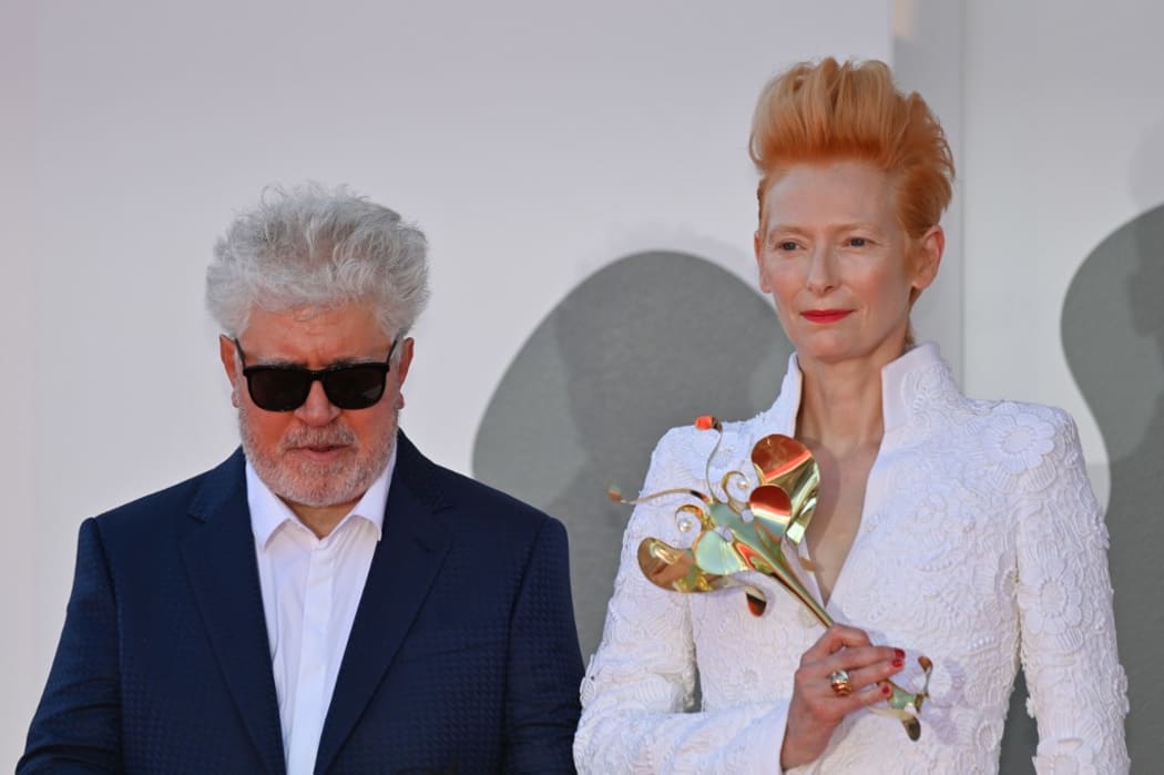 Spanish director Pedro Almodovar and British actress Tilda Swinton arrive for the screening of the film "The Human Voice" presented out of competition on the second day of the 77th Venice Film Festival.