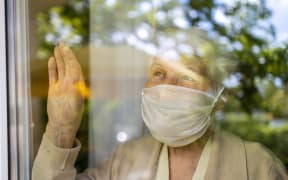 Elderly person in lockdown, isolation, isolate, Covid-19, mask, mental health.
