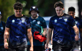 Chanel Harris-Tavita and Luke Metcalf during a Warriors training session at Go Media Stadium in Auckland.