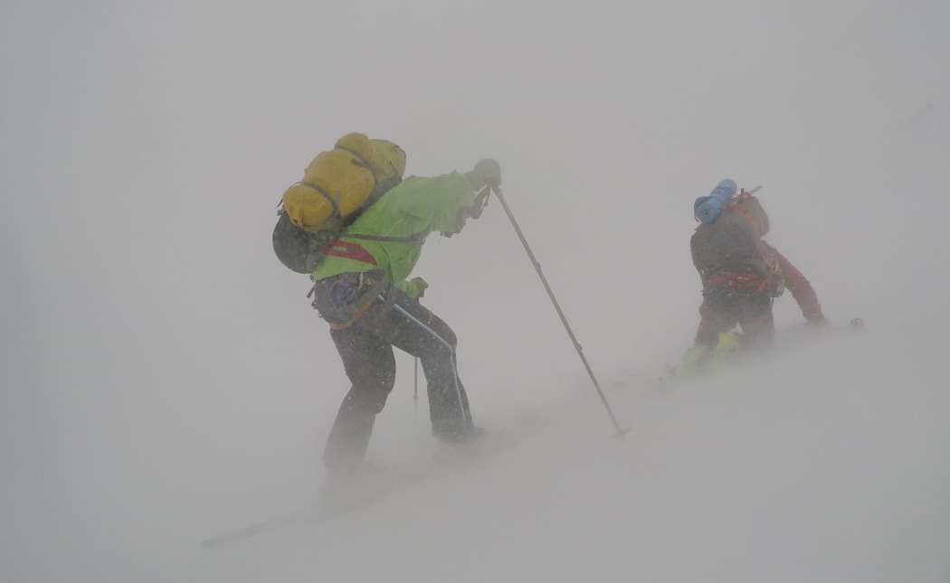 Tom MacTavish struggles against one of the violent squalls that struck the team during their crossing