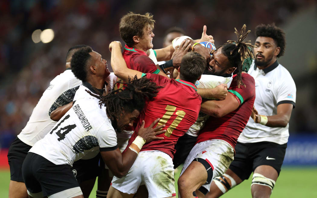 Fiji's centre Waisea Nayacalevu (second right) holds onto the ball in a maul during the France 2023 Rugby World Cup Pool C match between Fiji and Portugal at the Stade de Toulouse in Toulouse, southwestern France on October 8, 2023.