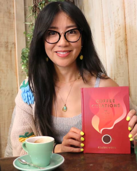 Coffee influencer, actress and author Celeste Wong at a cafe in Auckland with her book 'Coffee Creations: 90 delicious recipes for the perfect cup'.