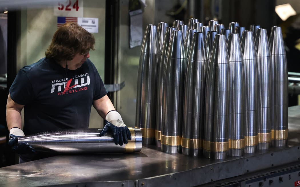 An employee handles 155 mm caliber shells after the manufacturing process at the Scranton Army Ammunition Plant (SCAAP) in Scranton, Pennsylvania on April 16, 2024. In brick buildings that are more than a century old, nearly in the heart of Joe Biden's Rust Belt hometown of Scranton, Pennsylvania, dated machinery churns artillery for modern conflicts, especially the war in Ukraine. The Scranton Army Ammunition Plant (SCAAP) is making steel tubes for 155 mm caliber shells, which are crucial to Kyiv's efforts to face down Moscow's invasion.
