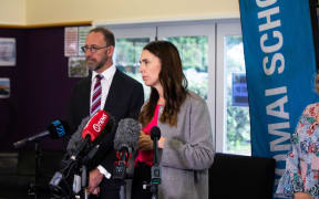 Jacinda Ardern makes Mana Ake announcement, Manurewa, 15 April. Andrew Little in the background.