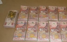 One person was found with almost $400,000 cash, during hte police raid.