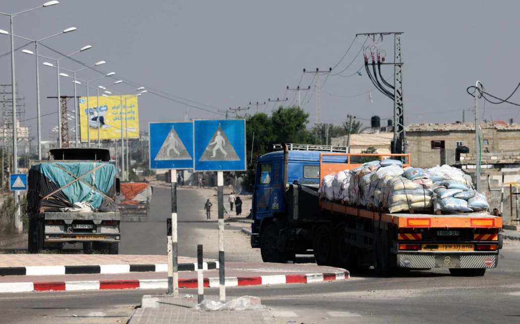 Trucks carrying humanitarian aid enter the southern Gaza Strip from Egypt via the Rafah border crossing on November 2, 2023, as battles between Israel and the Palestinian Hamas movement continue. (Photo by MOHAMMED ABED / AFP)