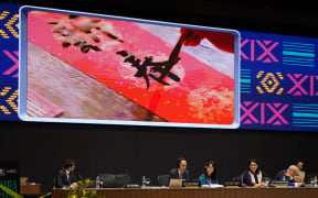 (241205) -- BEIJING, Dec. 5, 2024 (Xinhua) -- A video on Spring Festival is played during the 19th session of the Intergovernmental Committee for the Safeguarding of Intangible Cultural Heritage in Asuncion, Paraguay, Dec. 4, 2024.
  The United Nations Educational, Scientific and Cultural Organization (UNESCO) on Wednesday inscribed Spring Festival, social practices of the Chinese people in celebration of traditional new year on the Representative List of the Intangible Cultural Heritage of Humanity. (Xinhua/Zhu Yubo) (Photo by Zhu Yubo / XINHUA / Xinhua via AFP)