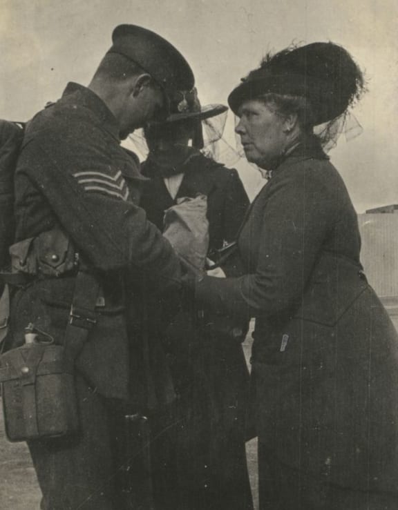 A mother farewells her son.
