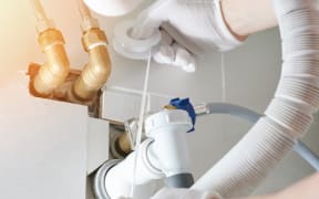 Fixing plumbing system in bathroom close up view