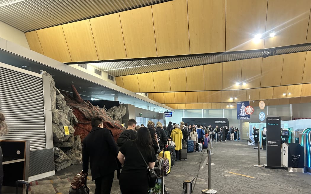 Hundreds of people queue at Wellington Airport ahead of travel disruptions to rebook their flights after more than 50 flights in and out of the capita were cancelled due to low lying cloud.