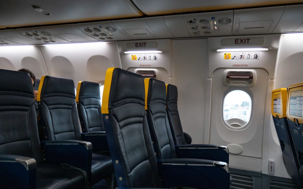 Emergency exit seats with more legroom. Boeing Sky Interior of a Boeing 737-800 of Ryanair low cost airline. The new cabin interior has mood lighting, thinner seats with more legroom, narrower overhead luggage compartment, growing the overhead space for the passenger. The aircraft is a new Boeing 737-800 that started flying in March 2018 with registration EI-GJK. The images are during the Thessaloniki, Greece SKG Makedonia Airport to Eindhoven, The Netherlands EIN airport flight. (Photo by Nicolas Economou/NurPhoto) (Photo by Nicolas Economou / NurPhoto / NurPhoto via AFP)