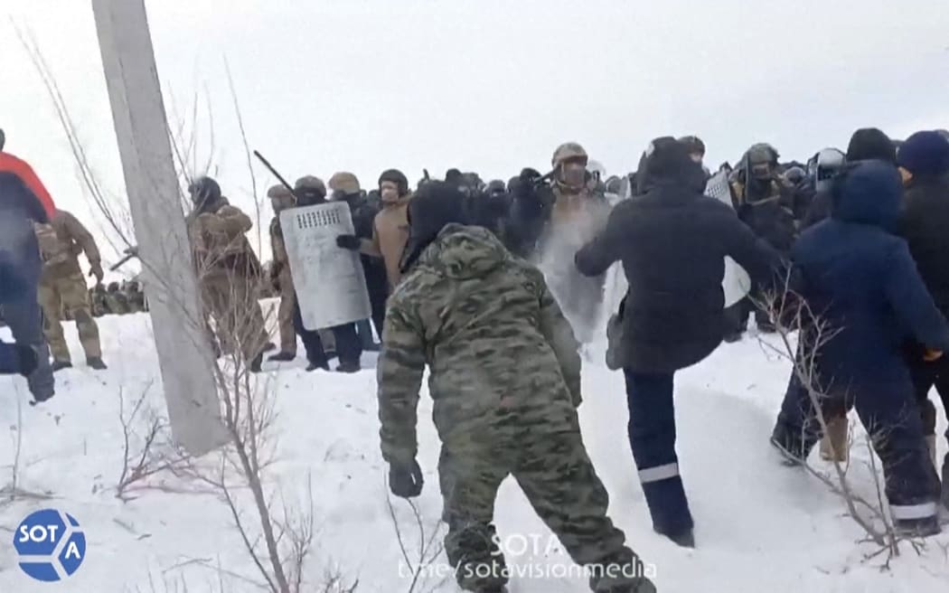 A video grab taken from a footage by SOTA on January 17, 2024 shows Russian police (Rear) disperse protests that erupted in the central Bashkortostan region after a court sentenced a local activist to four years in prison. Fail Alsynov, who campaigns against gold mining in the Urals region and advocates for the protection of the large ethnic Bashkir population's language, was sentenced for "inciting hatred" in the town of Baymak. (Photo by STRINGER / SOTA / AFP) / RESTRICTED TO EDITORIAL USE - MANDATORY CREDIT "AFP PHOTO / ESN/SOTAvision" - NO MARKETING NO ADVERTISING CAMPAIGNS - DISTRIBUTED AS A SERVICE TO CLIENTS
