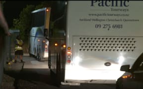 Buses arrived at Whangaparaoa carrying New Zealanders from Wuhan.