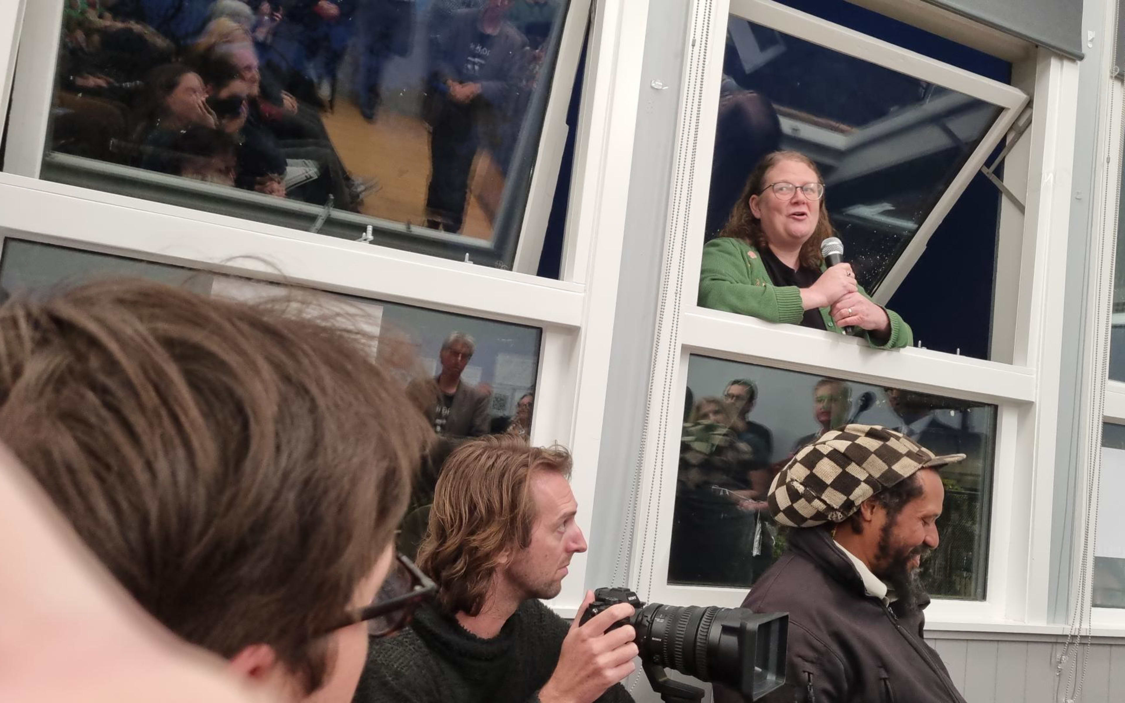 Questions from the packed Aro Valley debate are coming through windows from a crowd gathered outside who couldn't fit inside the community centre.