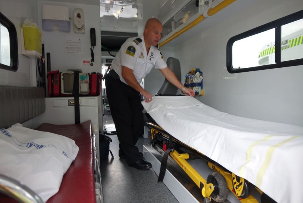 Tony Hohepa at work in the ambulance.