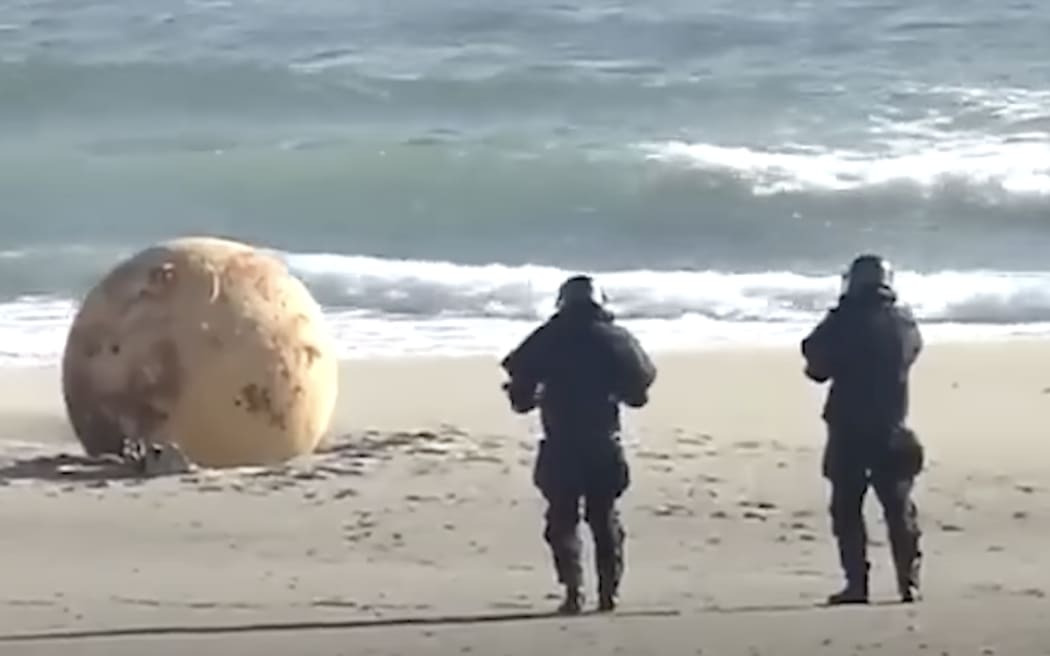 A mystery metal sphere found on beach has perplexed Japan.