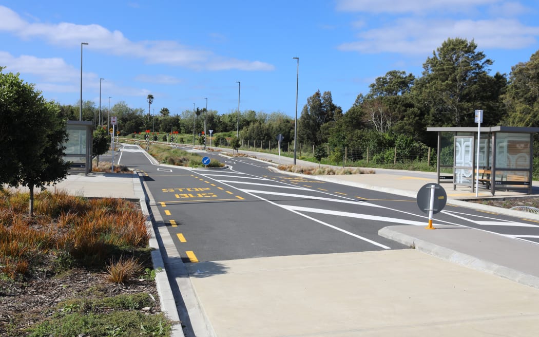 A portion of Joshua Carder Drive alongside Te Kori Scott Point park sits closed as the community awaits a private developer's works to complete the last connection to join the two portions of the road.
