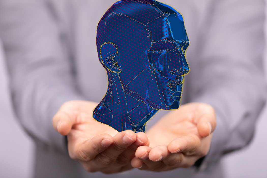 A digital concept of artificial intelligence with a human head on a hand.