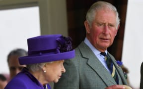 Britain's Queen Elizabeth II and Britain's Prince Charles, Prince of Wales look on during the annual Braemar Gathering in Braemar, central Scotland, on September 7, 2019.