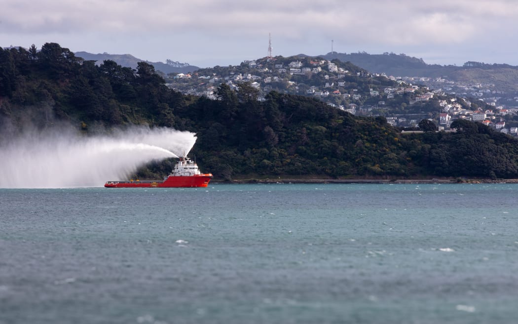 The last sail for Aratere Interisland ship , tug boat sending aratere off by spraying water