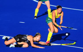 Brooke Roberts of Blacksticks Women with Renee Taylor of Austalia in defence