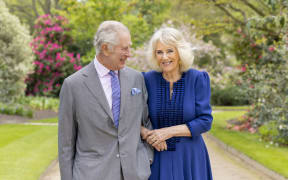 A handout photo issued by the Royal Household on April 26, 2024 shows Britain's King Charles III and Queen Camilla in the garden of Buckingham Palace in London, on April 10. British head of state King Charles III will make a limited return to public duties next week, after doctors said they were "very encouraged" by the progress of his treatment for cancer. The image, taken the day after their 19th wedding anniversary, was release to mark the first Coronation of the King. (Photo by Millie Pilkington / BUCKINGHAM PALACE / AFP) / RESTRICTED TO EDITORIAL USE - MANDATORY CREDIT "AFP PHOTO / BUCKINGHAM PALACE / Millie Pilkington " - NO MARKETING NO ADVERTISING CAMPAIGNS - DISTRIBUTED AS A SERVICE TO CLIENTS - NO SALES - NO COMMERCIAL USE INCLUDING ANY USE IN MERCHANDISING, ADVERTISING OR ANY OTHER NON-EDITORIAL USE - THIS IMAGE MUST NOT BE DIGITALLY ENHANCED, CROPPED, MANIPULATED OR MODIFIED IN ANY MANNER OR FORM. THIS PHOTO MAY SOLELY BE USED FOR EDITORIAL REPORTING PURPOSES FOR THE CONTEMPORANEOUS...