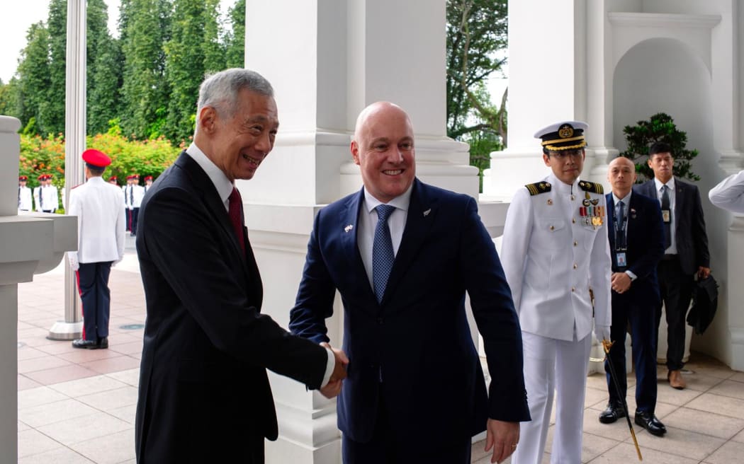 Prime Minister Christopher Luxon is welcomed by his Singaporean counterpart, Prime Minister Lee Hsien Loong, at the Istana - the official residence of the president, Tharman Shanmugaratnam.