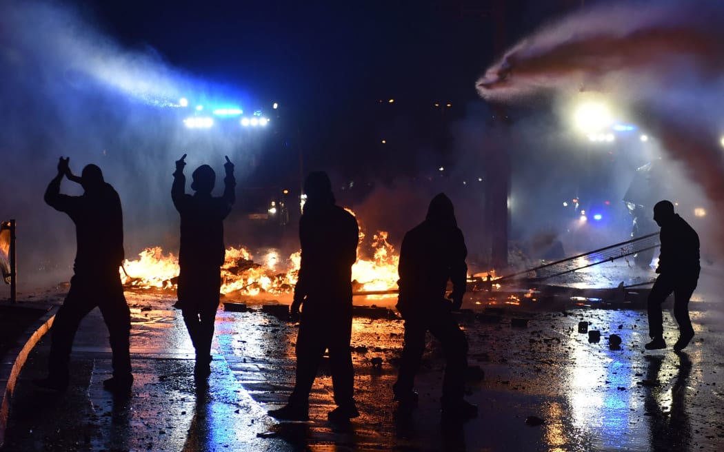 Riot police use water cannon on July 7, 2017 in Hamburg, northern Germany, where leaders of the world's top economies gather for a G20 summit.