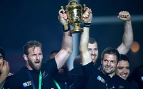 All Blacks Kieran Read, left, and Richie McCaw lift the Webb Ellis Cup.