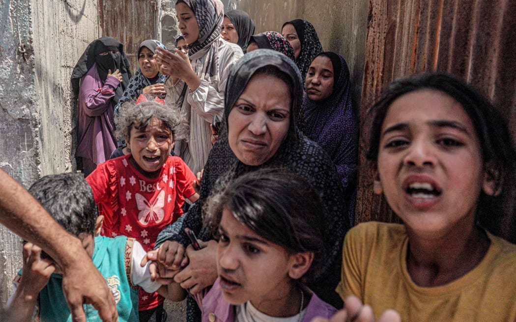 EDITORS NOTE: Graphic content / Children react as they flee following Israeli bombardment in Nuseirat in the central Gaza Strip on April 29, 2024, amid the ongoing conflict in the Palestinian territory between Israel and the militant group Hamas. (Photo by AFP)