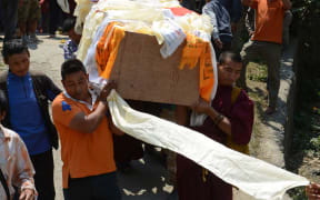 Thirteen guides died and three others are missing.