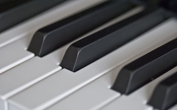 Piano keyboard close up.