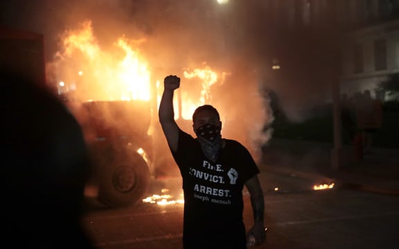 Fires burn around downtown Wisconsin during a second night of rioting