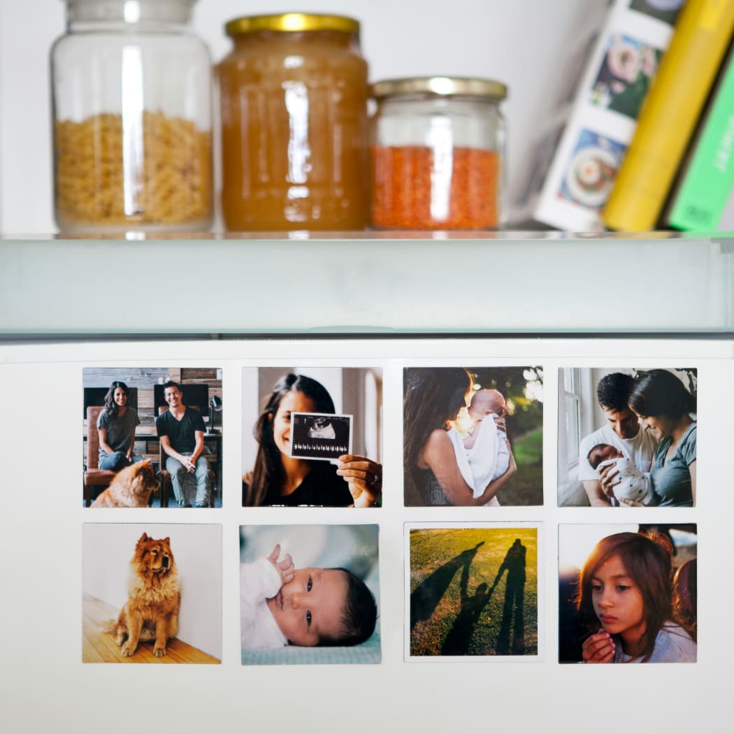 Family photos on fridge.