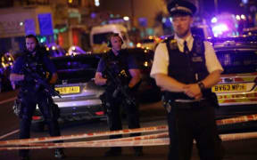 Police guard a street in the Finsbury Park area of north London where a van hit pedestrians on June 19.