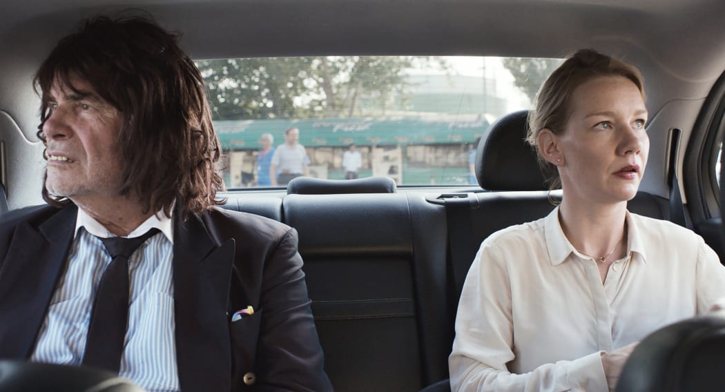 Peter Simonischek and Sandra Hüller on their way to another important business meeting in Toni Erdmann