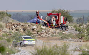 Rescuers use a Metalliferous Mobile Rescue Winder during a rescue operation to retrieve illegal miners from an abandoned gold shaft in Stilfontein on January 13, 2025. Rescuers hoisted seven illegal miners and at least four bodies out of an abandoned gold mine in South Africa on January 13, 2025 amid claims that hundreds more may be underground as well as many corpses.
A professional mine rescue company sent a large cage down into the shaft, launching an official operation to retrieve men at the site near Stilfontein, about 140 kilometres (90 miles) southwest of Johannesburg. (Photo by Christian Velcich / AFP)