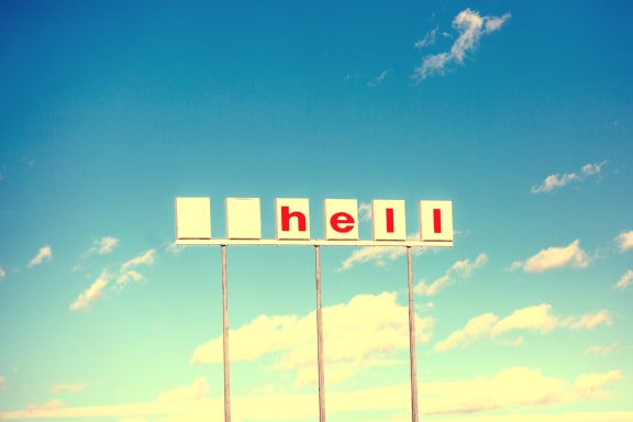 Abandoned Shell petrol station sign with logo and first letter missing - now reading "hell"