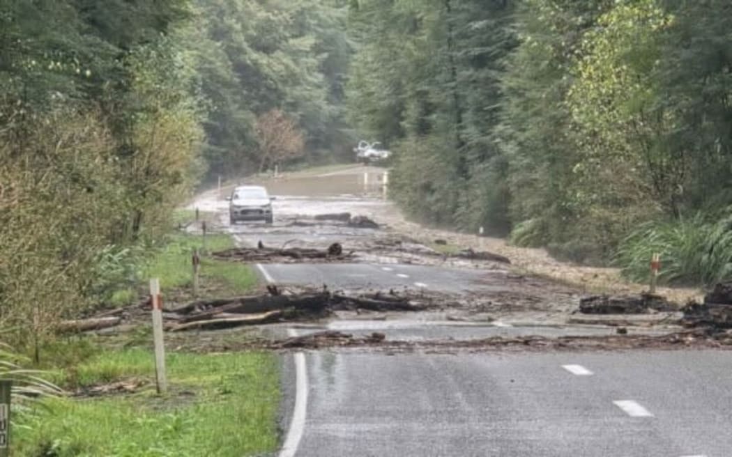 The road obstructed at Rahu Saddle, on the closed section of SH7 between Reefton and Springs Junction