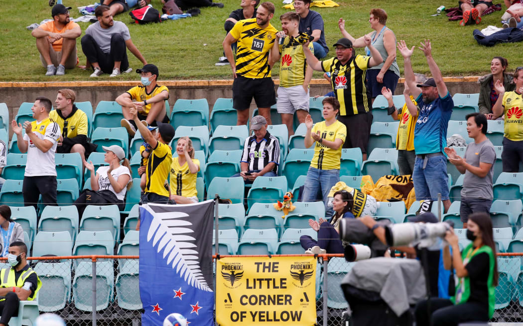 Phoenix fans celebrate after David Ball scores during the A-League match between  Wellington Phoenix and Sydney FC at Leichhardt Oval in Sydney