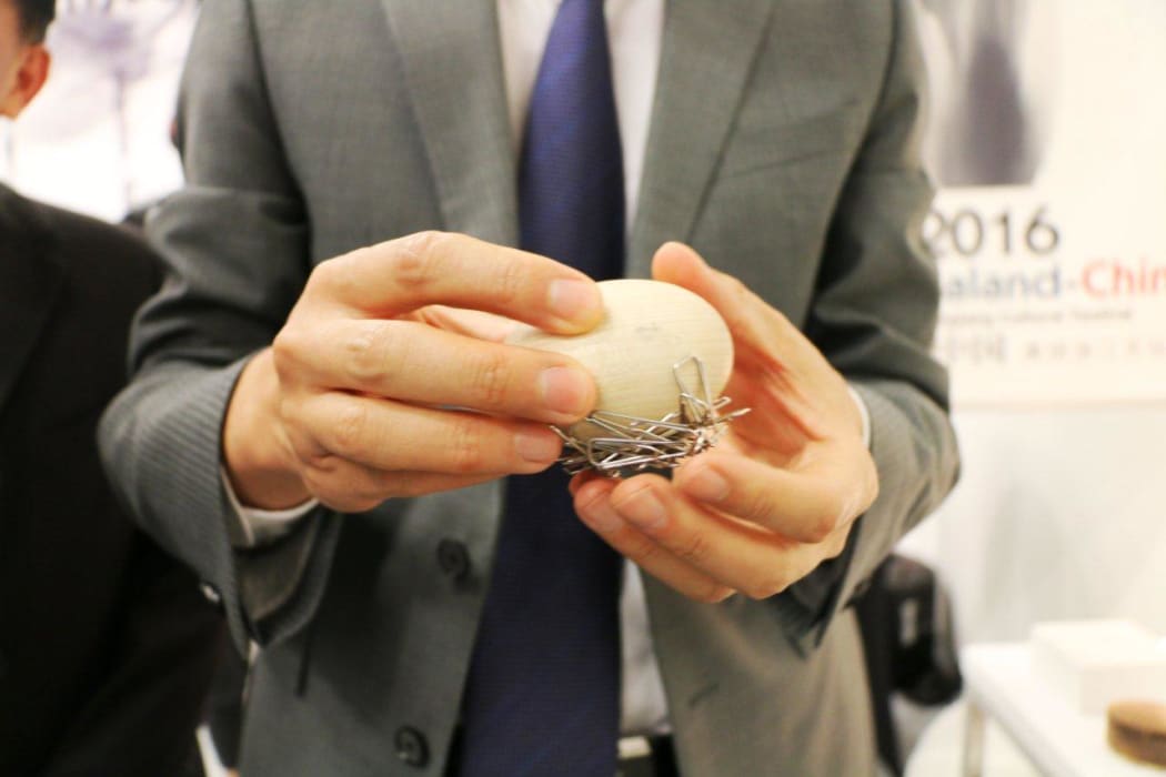 Chinese ambassador with magnetised egg
