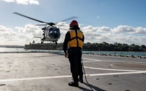 A NH90 helicopter lands onboard the HMNZS Canterbury.