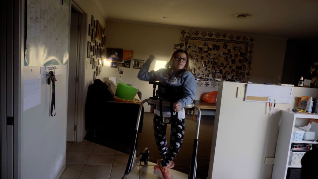 Alicia Kapa uses her standing frame at home.