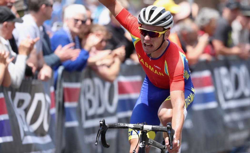 Jason Christie celebrates his second national men's road race title.
