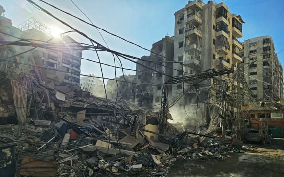 Rubble of destroyed buildings is pictured at the site of an Israeli airstrike that targeted Rweiss neighbourhood in Beirut's southern suburbs, on March 8, 2026. AFPTV footage showed smoke billowing over the southern suburbs of Beirut on March 8 following an apparent air strike on the area where Lebanese militant group Hezbollah holds sway. Several hours earlier, the Israeli military said it had launched strikes on "Hezbollah infrastructure" in that area. (Photo by AFP)