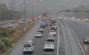 Stormy weather in Auckland, on 4 April, 2025: morning traffic on Sunset Road overpass heading into the city.
